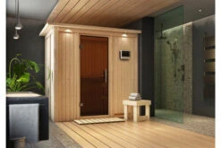 KARIBU Variado Sauna, Naturbelassen, Fichte, 210 X 132 X 202 Cm, Fronteinstieg, Mit Graphitfarbener Tür Und Kranz, SET Mit Ofen 4,5 KW Bio Ext. Strg.